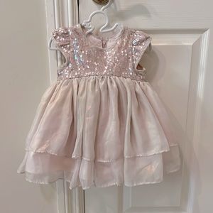12 month special occasions cream peach dress with multiple layers and sequins.